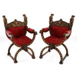 A PAIR OF OAK SAVONAROLA ARMCHAIRS, 19TH CENTURY 
each shaped back rail carved with scrolling
