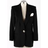 AN ESCADA WOOL BLAZER A classic vintage black blazer. A notched lapel with two front pockets and a