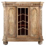 SPANISH STYLE LIMED OAK CUPBOARD the moulded cornice with canted corners above a carved frieze, a