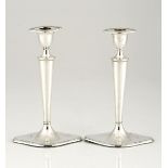 A PAIR OF EDWARDIAN SILVER CANDLESTICKS, WILLIAM HUTTON & SONS, LONDON, each shaped ovoid base