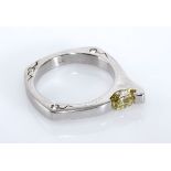 A DIAMOND RING, ORPHEO tension-set to the side with a modified oval-cut diamond weighing 0.72cts,