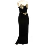 A BELVILLE SASSOON EVENING DRESS A glamorous black velvet dress with gold beads and pearls