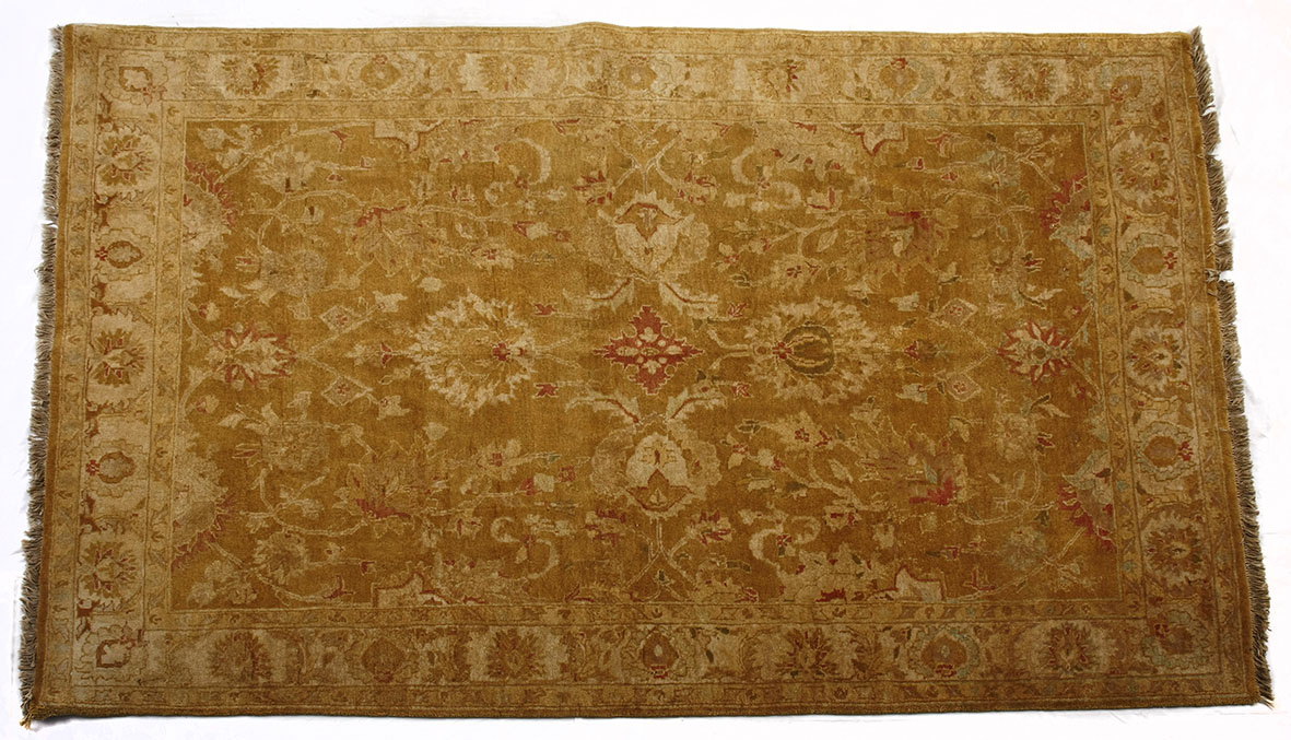 AN INDO PERSIAN CARPET, MODERN The gold field with an overall palmette and leaf design depicted in