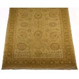 AN INDO PERSIAN FLATWEAVE CARPET the pale gold field with an overall design of palmette and vine