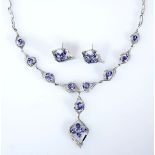 A TANZANITE AND DIAMOND DEMI-PARURE comprising: a necklace and a pair of earrings, each of