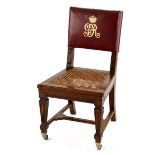 A GEORGE V OAK PARLIAMENTARY CHAIR the padded close-nailed back inscribed with the monogram GR