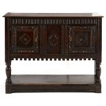 A SPANISH OAK COURT CUPBOARD, 18TH CENTURY the rectangular top above a carved frieze, a pair of