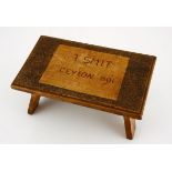 Ceylon Boer P.O.W. Footstool 1901 28,5 by 18cm. Height: 12,5cm. Splayed, shaped feet, two feet