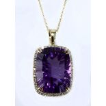 AN AMETHYST AND DIAMOND PENDANT centred with a modified mixed-cut amethyst weighing approximately