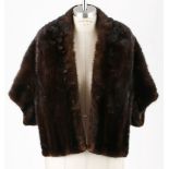 A BROWN MINK BOLERO Stole style with small sleeves. Fully lined. Label: “Blackglama”. 46cm from