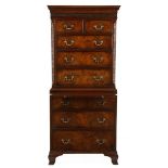 A FLAME MAHOGANY CHEST-ON-CHEST, 19TH CENTURY in two parts, the stepped pediment above a dentil