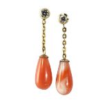 A PAIR OF CORAL AND DIAMOND PENDANT EARRINGS each surmount bezel-set with a round brilliant-cut