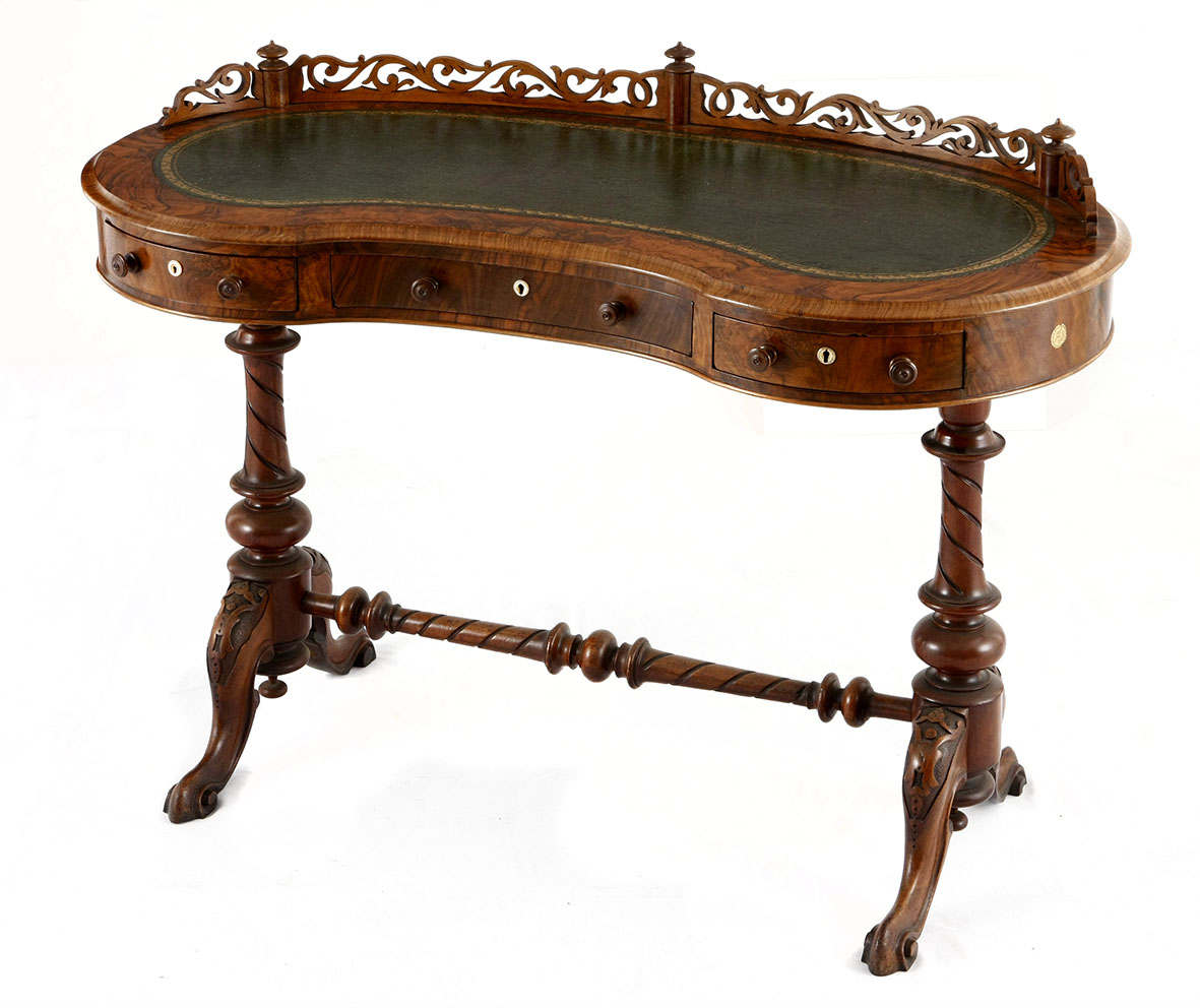 A VICTORIAN BURR-WALNUT WRITING TABLE, 19TH CENTURY the kidney-shaped top with a three-quarter