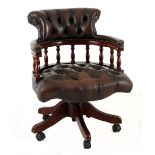 A MAHOGANY AND UPHOLSTERED CHESTERFIELD OFFICE CHAIR the adjustable close-nailed button-back, side