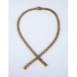 AN 18CT GOLD NECKLACE composed of fancy twin-curb links terminating with two tassels, with box clasp