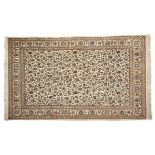 A FINE KESHAN SILK RUG, PERSIA, MODERN the ivory field with an overall design of polychrome