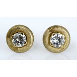 A PAIR OF DIAMOND EAR STUDS each claw-set with a round brilliant-cut diamond weighing