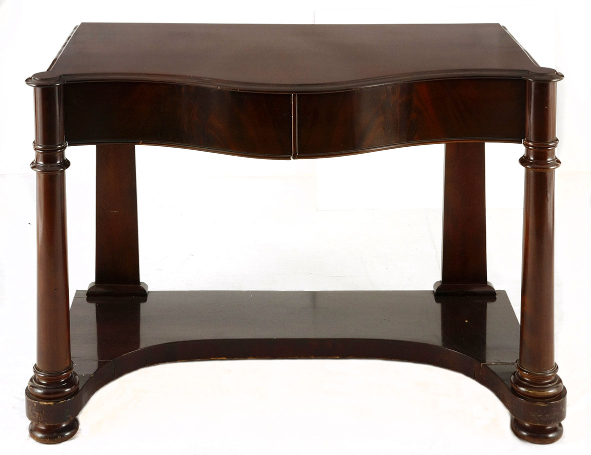 A VICTORIAN MAHOGANY CONSOLE TABLE, 19TH CENTURY the moulded serpentine-shaped top above a pair of