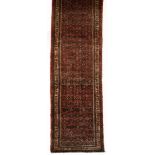 A BIRJALOU RUNNER, WEST PERSIA, MODERN the red field with an overall multi coloured “herati” pattern