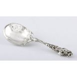 AN AMERICAN SILVER SERVING SPOON, A. STOWELL & CO., 1865-1904 the handle and part bowl chased with
