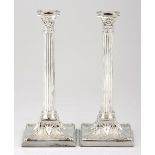 A PAIR OF LATE VICTORIAN CORINTHIAN CANDLESTICKS, WALKER & HALL, SHEFFIELD each fluted column chased