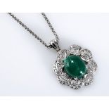 AN EMERALD AND DIAMOND PENDANT centred with a cabochon emerald weighing 9.28cts, within a laurel