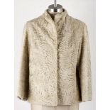 A CRÈME SWAKARA JACKET Vintage fur cut in a contemporary style. Mandarin style collar. Side pockets.