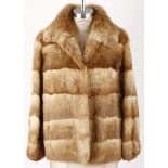 A GOLDEN RABBIT FUR JACKET A lush golden tone vintage fur jacket. Fully lined in satin. Secret front