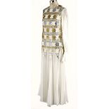 A SILK CHIFFON WHITE EVENING GOWN A magnificent vintage floor-length gown. Silver and gold foiled