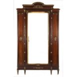 A LOUIS XVI WALNUT, PARQUETRY AND GILT-METAL MOUNTED ARMOIRE the arched pediment above a central