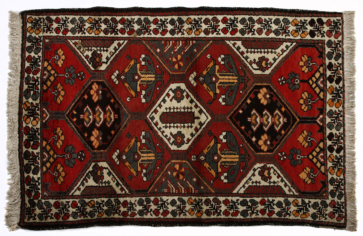 A BAKTIARI RUG, PERSIA, MODERN the field divided into diamond medallion depicted in red, blue and