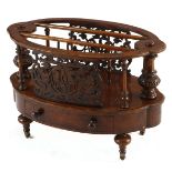 A VICTORIAN BURR-WALNUT CANTERBURY of oval form with three divisions, the sides applied with pierced