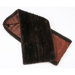 A SHEARED BEAVER SHAWL Chocolate brown vintage fur. Lined in satin. Label: "Jakes the Furrier". 40cm