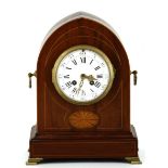 An Edwardian Lancet Shaped Table Clock a small solid mahogany mantel clock, having a lancet shaped