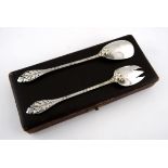 A CASED PAIR OF FRENCH SILVER SALAD SERVERS each with floral detail and a monogram on the reverse,