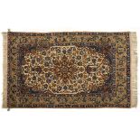 A FINE ISFAHAN RUG, PERSIA, MODERN the ivory field with a pale green floral star medallion, sky blue