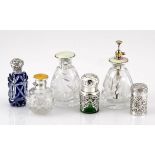 A MISCELLANEOUS COLLECTION OF SILVER-MOUNTED SCENT BOTTLES, VARIOUS MAKERS AND DATES, BIRMINGHAM, in