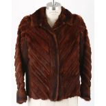 AN ERMINE AND SUEDE JACKET A lightweight cropped vintage fur jacket in rust colour, integrated