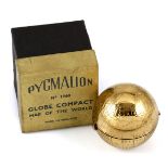 A 1950'S NOVELTY BRASS GLOBE COMPACT BY PYGMALION The hinged compact modelled as a globe of the