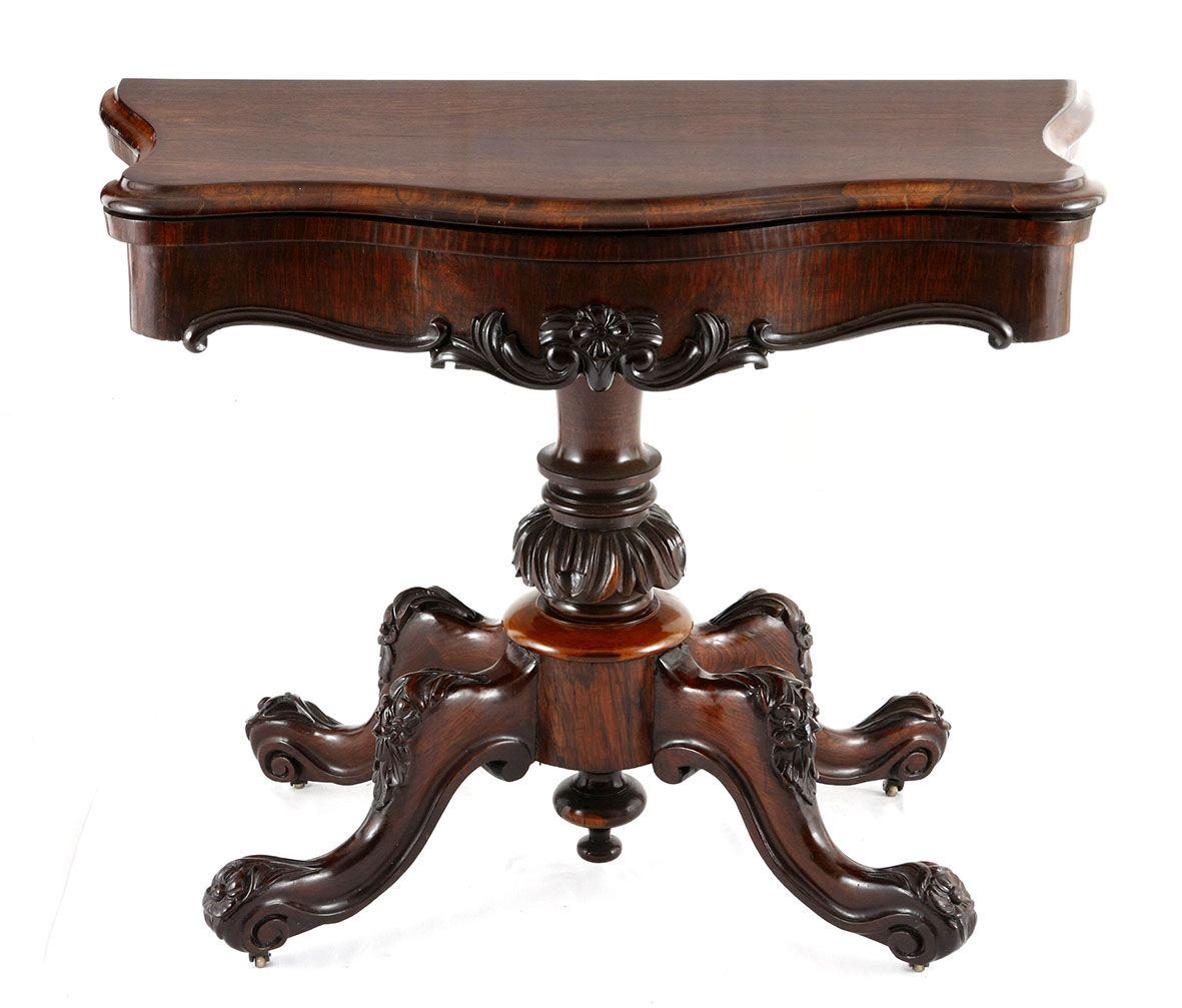 A WILLIAM IV ROSEWOOD CARD TABLE the hinged rectangular swivel top enclosing a baize-lined playing