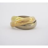 AN 18CT GOLD 'TRINITY DE CARTIER' RING in rose, white and yellow gold, Swiss mark for 18ct gold,