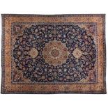 A MESHED CARPET, PERSIA, MODERN the indigo-blue field with a floral gold medallion and pendant, blue