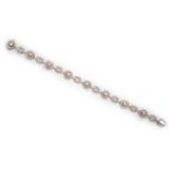 A DIAMOND BRACELET, BROWNS designed as a series of alternating target motifs and oval links,