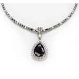 A DIAMOND ENHANCER PENDANT centred with a pear-shaped black diamond weighing 7.520cts, enclosed