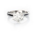 A DIAMOND SOLITAIRE RING claw set to the centre with a brilliant-cut diamond weighing 2.5170cts,