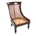 A STINKWOOD AND CANED BERGÈRE STYLE CHILD'S CHAIR, 19TH CENTURY the rectangular-shaped caned back,