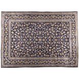 A KESHAN CARPET,PERSIA,MODERN the deep indigo blue field with an overall design of polychrome vines,