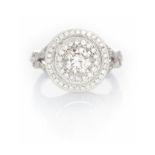 A DIAMOND RING centred with a claw-set brilliant-cut diamond weighing 0.7400cts, the conforming