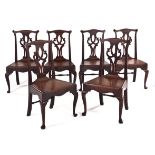 A SET OF SIX OAK SIDE CHAIRS, EARLY 20TH CENTURY each shaped top rail above a pierced and carved