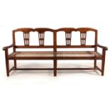 A CAPE NEO-CLASSICAL STINKWOOD RUSBANK the arched top rail and reeded bottom rail joined by
